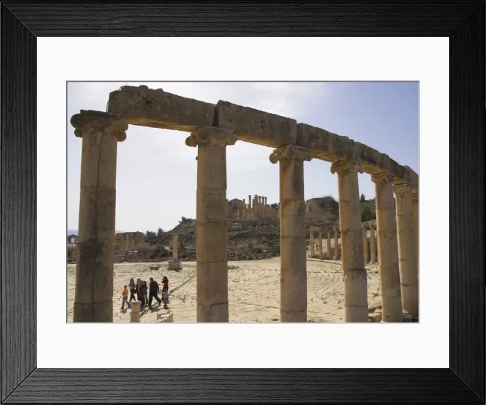 Framed Print : Backlit view through columns with family walking past Framed Print : Backlit view through columns with family walking past