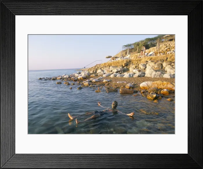 Framed Print : Man floating in Dead Sea Framed Print : Man floating in Dead Sea