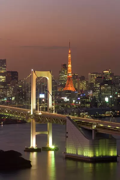 Elevated view of Rainbow Bridge and Tokyo Tower illuminated at dusk