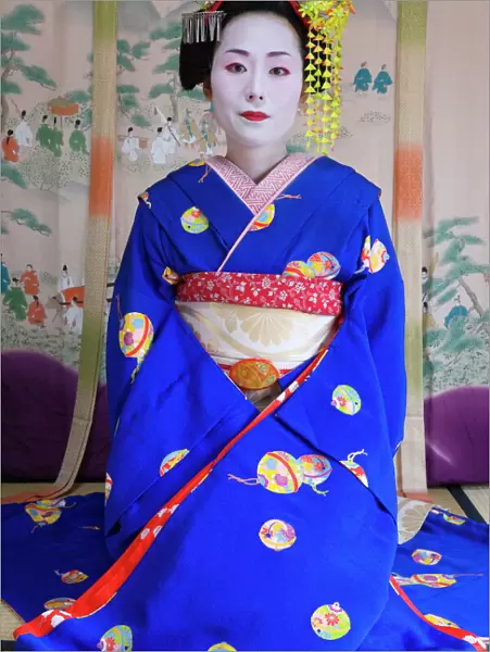 Portrait of a Geisha in a traditional Japanese style tatami mat room