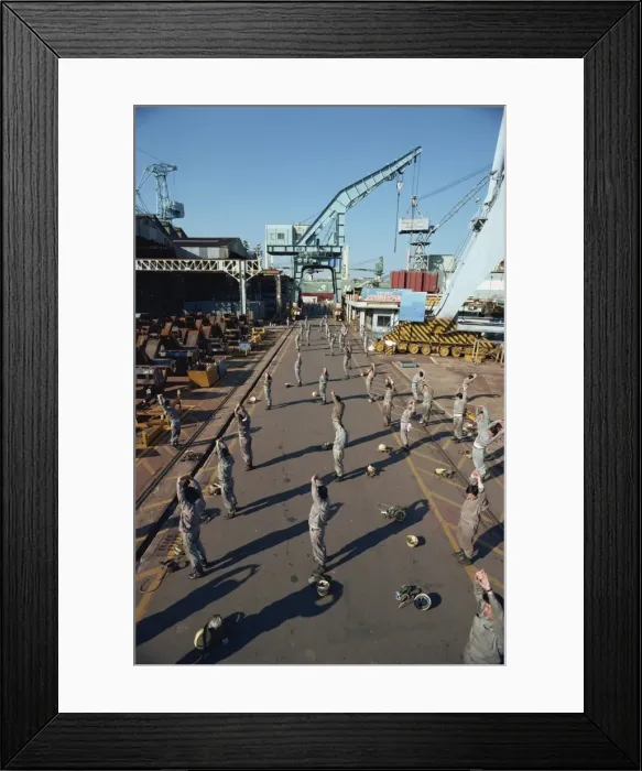 Framed Print : Workers stretching and exercising before work in the morning