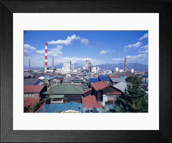 Framed Print : Industrial complex of paper mill and city skyline
