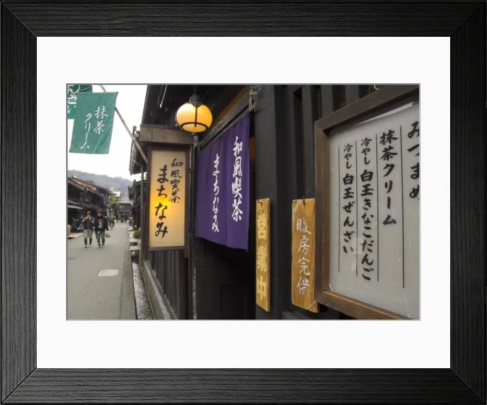 Framed Print : Traditional street lined with shops and restaurants Framed Print : Traditional street lined with shops and restaurants