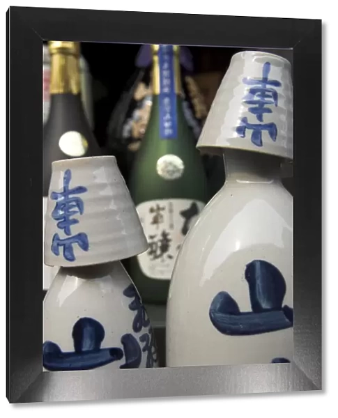 Traditional sake bottle with assorted glasses