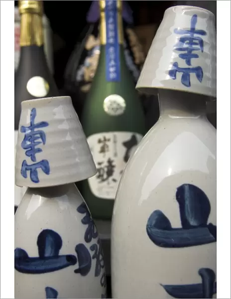 Traditional sake bottle with assorted glasses