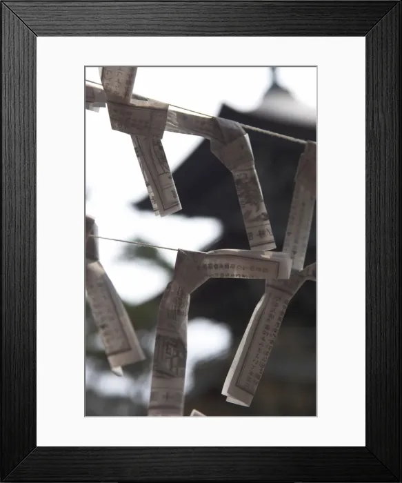 Framed Print : Close up of traditional wish and fate papers tied up on line Framed Print : Close up of traditional wish and fate papers tied up on line