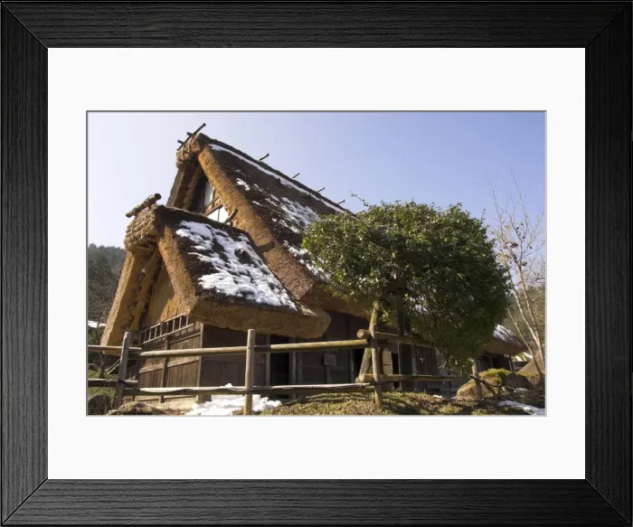 Framed Print : Traditional house with thick thatch roof Framed Print : Traditional house with thick thatch roof