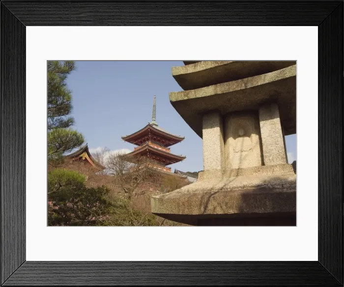 Framed Print : Red pagoda and stone lantern with image of Buddha Framed Print : Red pagoda and stone lantern with image of Buddha