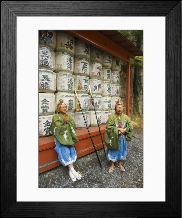 Framed Print : Men traditional clothing sitting in front of colourful sake barrels