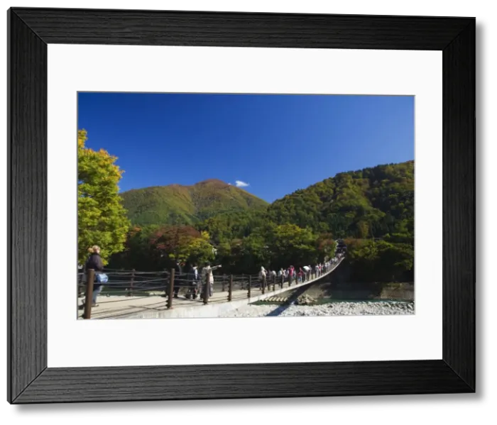 Framed Print : Suspension bridge with tourists looking at autumn colours Framed Print : Suspension bridge with tourists looking at autumn colours