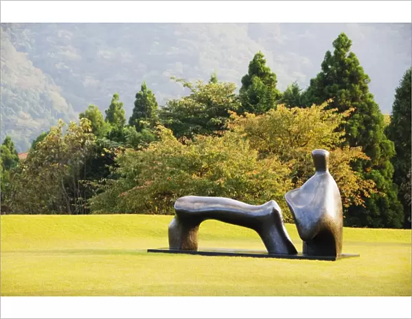 A reclining bronze sculpture at Chokokunomori Sculpture Park