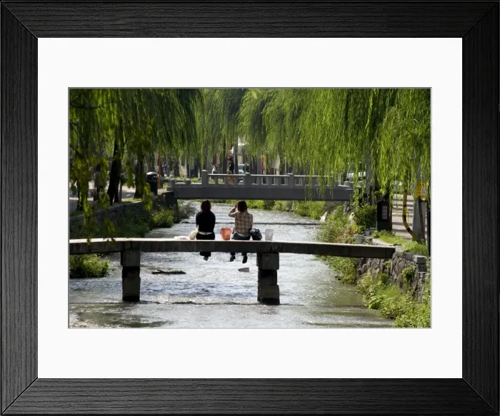 Framed Print : Two girls sitting on bridge Framed Print : Two girls sitting on bridge