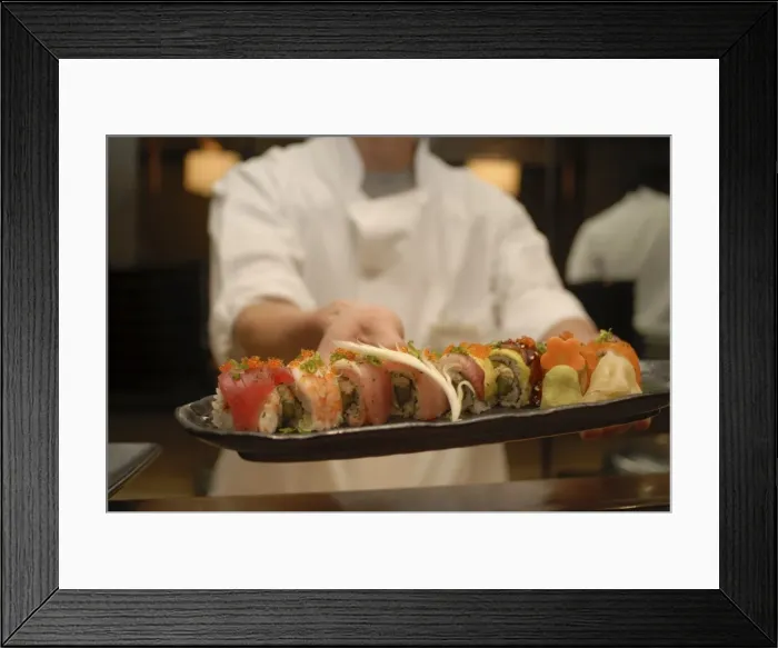 Framed Print : Sushi chef presents a plate of various seafood sushi Framed Print : Sushi chef presents a plate of various seafood sushi