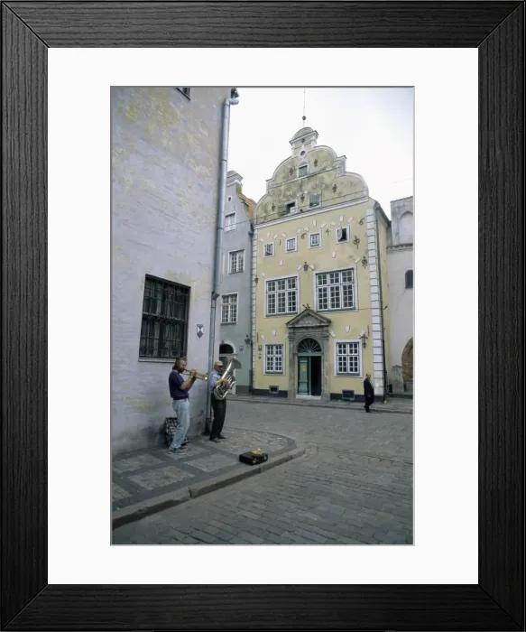 Framed Print : Street musicians play by the Three Brothers Framed Print : Street musicians play by the Three Brothers