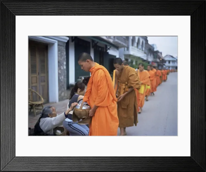 Framed Print : Novice Buddhist monks collecting alms of rice Framed Print : Novice Buddhist monks collecting alms of rice