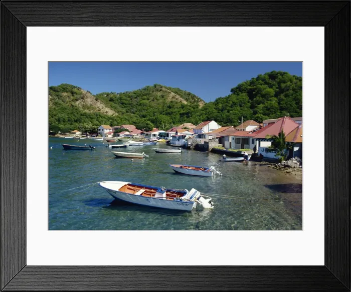 Framed Print : Boats moored behind houses built on the beach of a bay