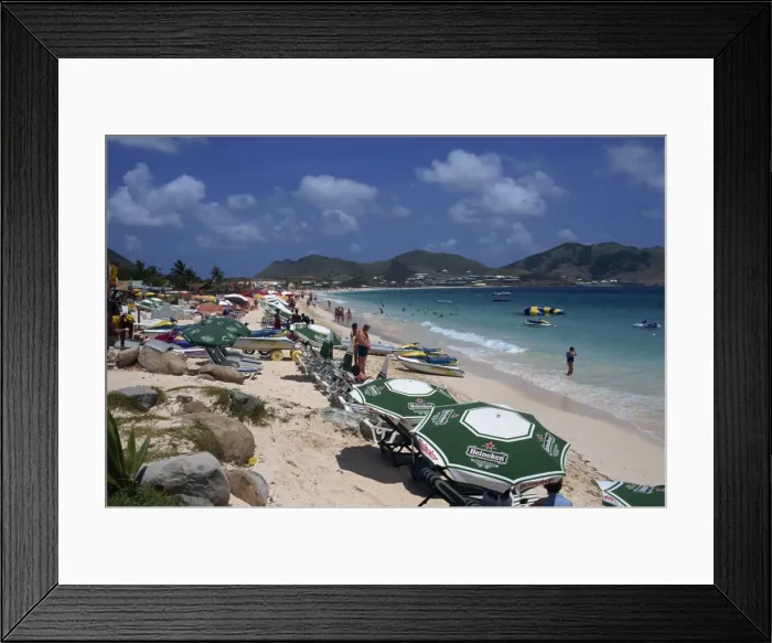 Framed Print : Tourists on loungers under parasols or beach umbrellas Framed Print : Tourists on loungers under parasols or beach umbrellas