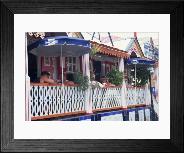 Framed Print : People sitting at tables on the terrace in a restaurant Framed Print : People sitting at tables on the terrace in a restaurant