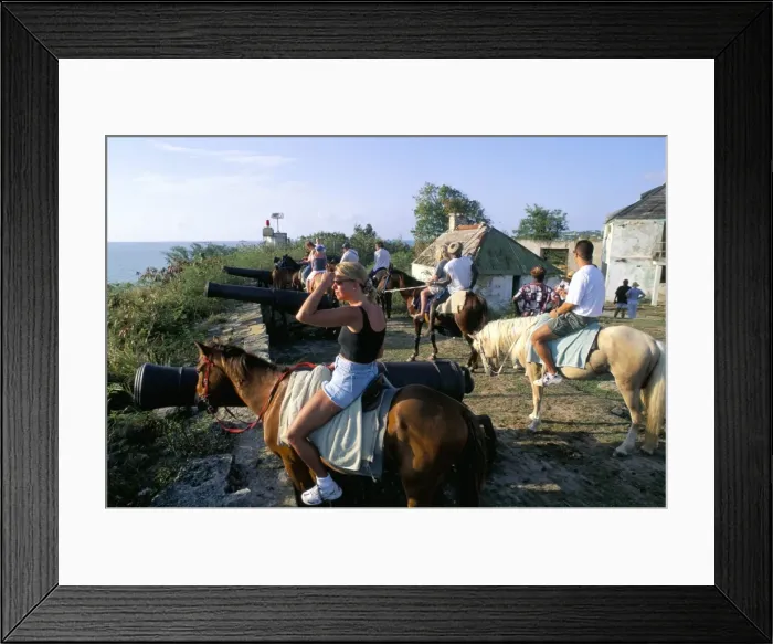 Framed Print : Tourists on horseback in historic Fort James, St Framed Print : Tourists on horseback in historic Fort James, St