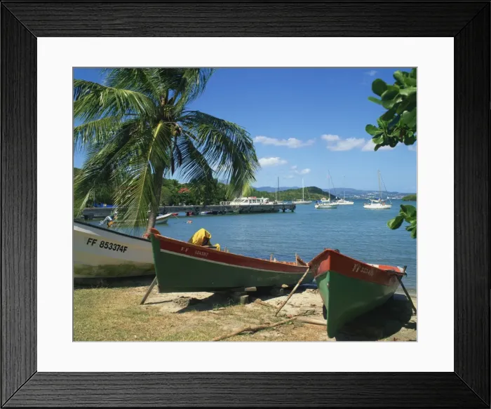 Framed Print : Fishing boats pulled up onto the beach at Trois Ilets Harbour Framed Print : Fishing boats pulled up onto the beach at Trois Ilets Harbour
