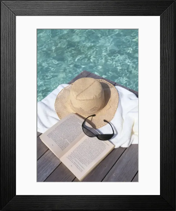 Framed Print : Straw hat, book and sunglasses on towel Framed Print : Straw hat, book and sunglasses on towel