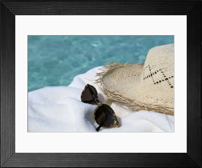 Framed Print : Straw hat and sunglasses on towel Framed Print : Straw hat and sunglasses on towel
