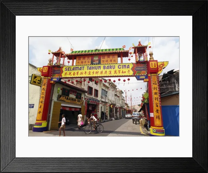 Framed Print : Colourful gateway and street scene in the town of Malacca in Malaysia Framed Print : Colourful gateway and street scene in the town of Malacca in Malaysia