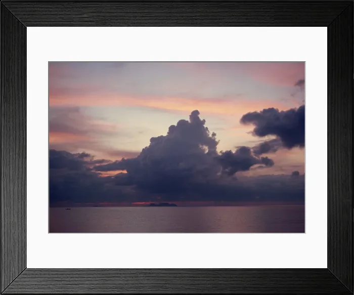 Framed Print : Towering dark grey clouds in a pink and blue sky over Framed Print : Towering dark grey clouds in a pink and blue sky over