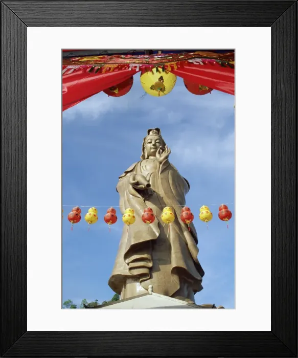 Framed Print : Red and yellow lanterns in front of the standing statue of Kuan Yim Framed Print : Red and yellow lanterns in front of the standing statue of Kuan Yim