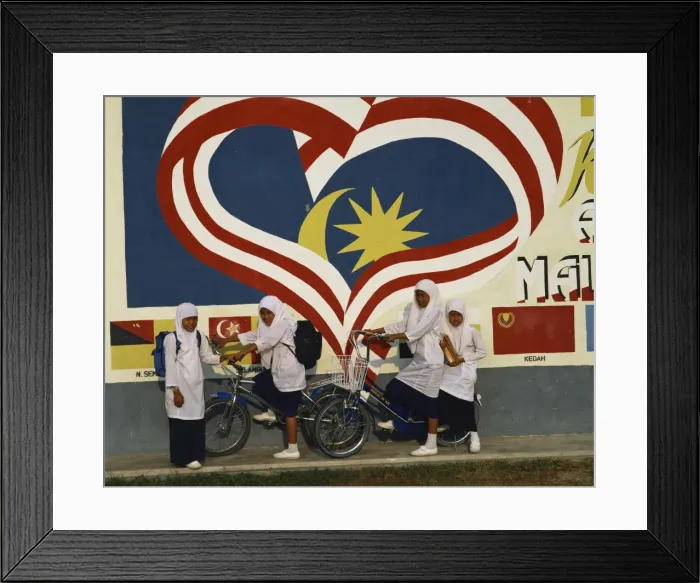 Framed Print : Moslem girls on bicycles in Malaysia Framed Print : Moslem girls on bicycles in Malaysia