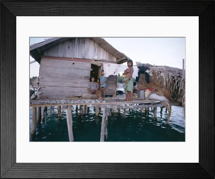 Framed Print : Bajau family in stilt house over the sea Framed Print : Bajau family in stilt house over the sea