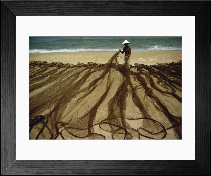 Framed Print : Man laying out fishing nets on bank of the Dingun River Framed Print : Man laying out fishing nets on bank of the Dingun River