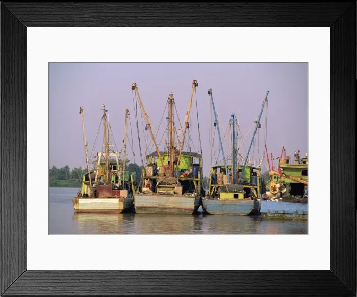 Framed Print : Fishing boats on the Sarawak River waterfront in Kuching Framed Print : Fishing boats on the Sarawak River waterfront in Kuching