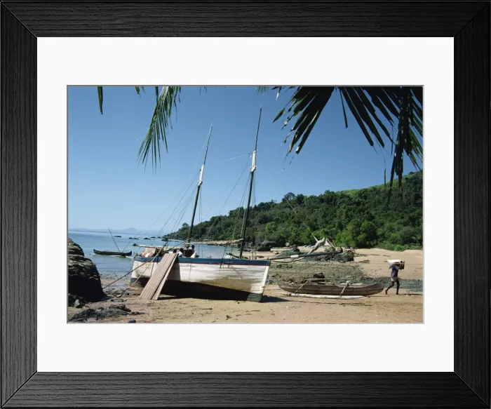Framed Print : Man unloading rice from boat onto beach Framed Print : Man unloading rice from boat onto beach
