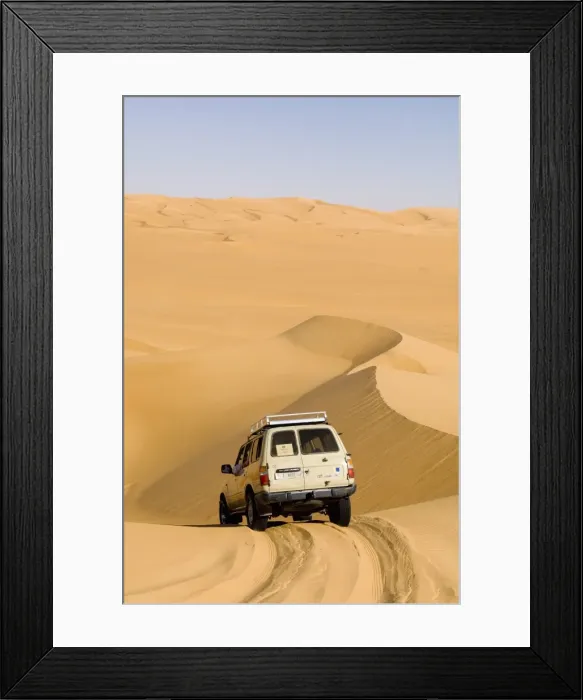 Framed Print : SUV on sand dunes