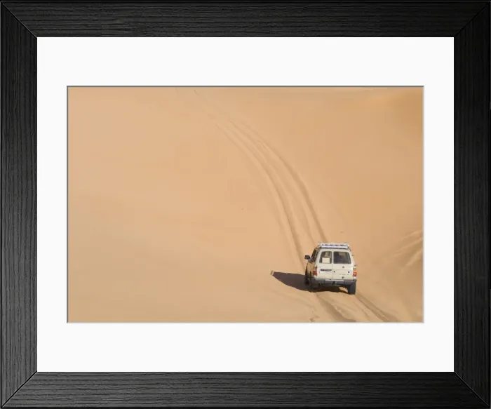 Framed Print : SUV on sand dunes