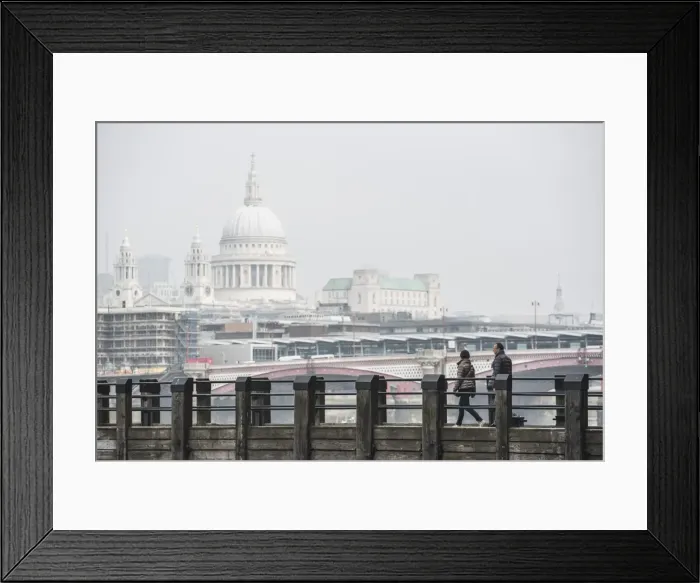 Framed Print : Couple on a pier overlooking St. Pauls Cathedral on the banks of the River Thames Framed Print : Couple on a pier overlooking St. Pauls Cathedral on the banks of the River Thames