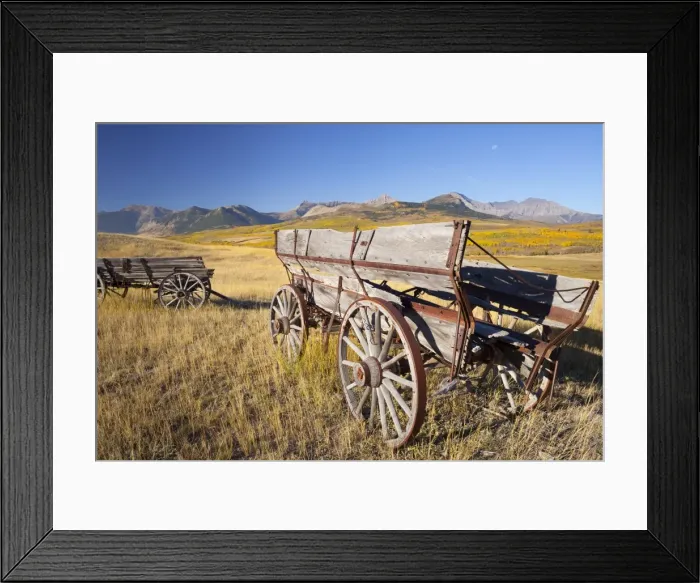 Framed Print : Old horse-drawn wagons with the Rocky Mountains in the background, near Waterton Framed Print : Old horse-drawn wagons with the Rocky Mountains in the background, near Waterton