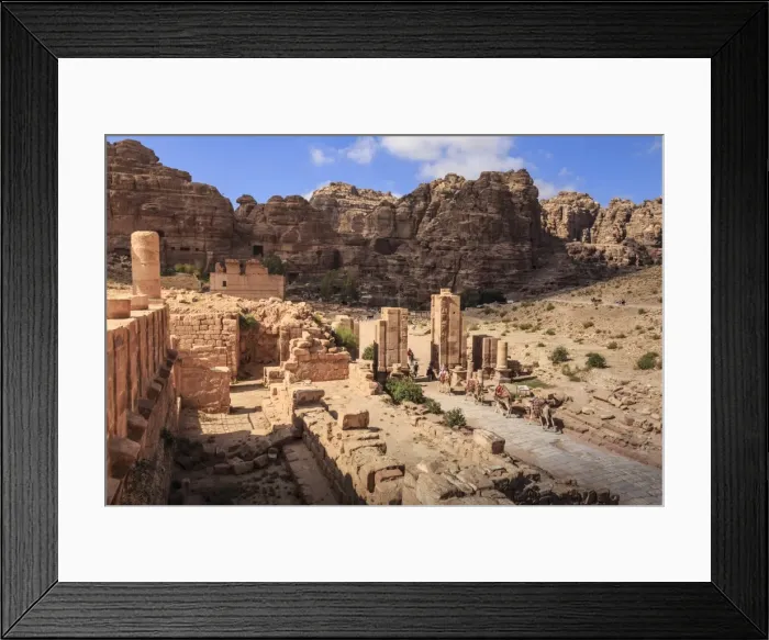 Framed Print : Camel train approaches Temenos Gateway with Qasr al-Bint temple, City of Petra ruins Framed Print : Camel train approaches Temenos Gateway with Qasr al-Bint temple, City of Petra ruins