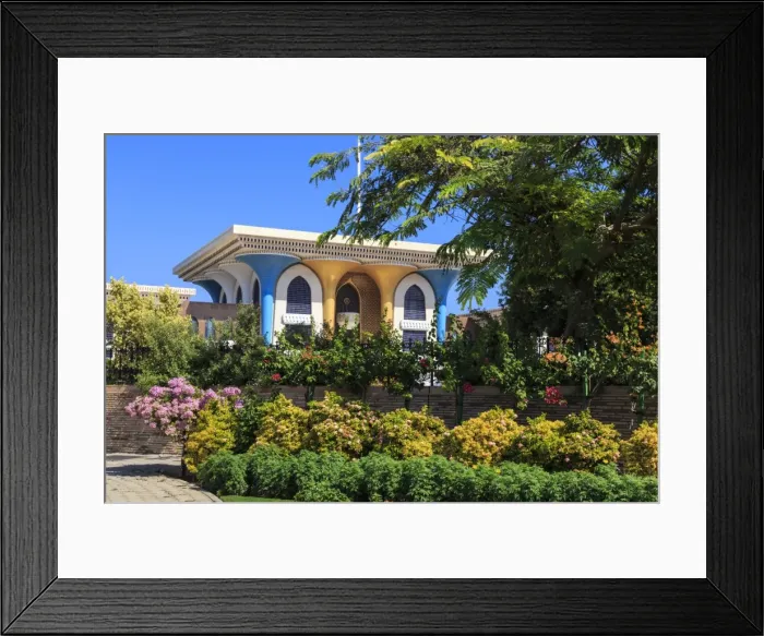 Framed Print : Sultans Palace, with mushroom pillars of blue and gold, viewed beyond lush greenery Framed Print : Sultans Palace, with mushroom pillars of blue and gold, viewed beyond lush greenery