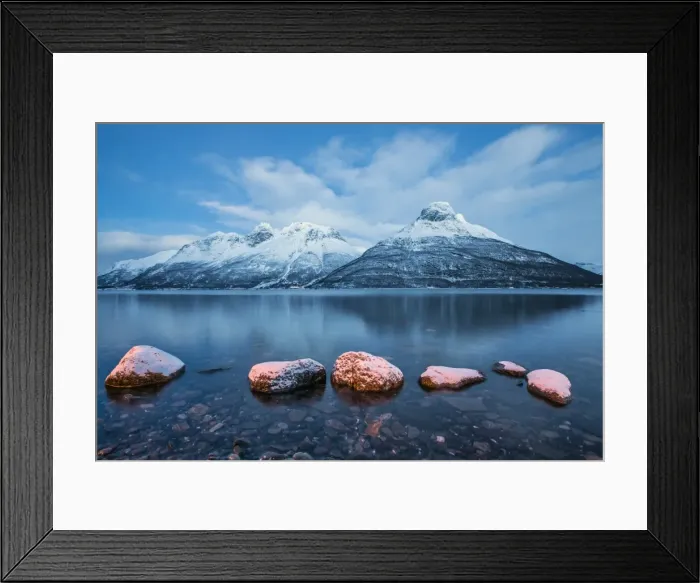 Framed Print : Blue sky at dusk and snowy peaks are reflected in the frozen sea, Storfjorden, Lapland
