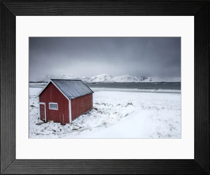 Framed Print : A typical house of the fishermen called rorbu on the snowy beach frames the icy sea at Ramberg Framed Print : A typical house of the fishermen called rorbu on the snowy beach frames the icy sea at Ramberg