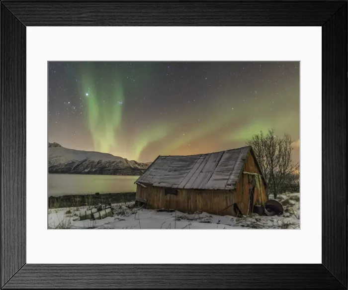 Framed Print : The Northern Lights illuminates the wooden cabin, Svensby, Lyngen Alps, Troms, Lapland