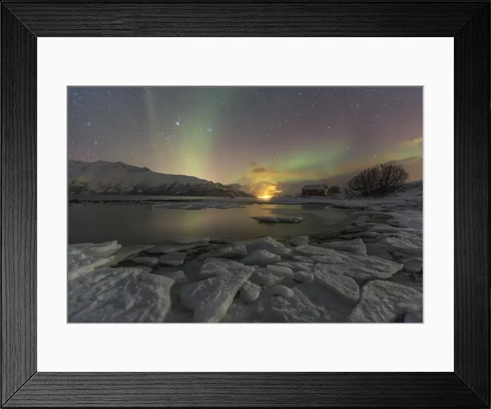 Framed Print : The Northern Lights illuminates the icy landscape in Svensby, Lyngen Alps, Troms