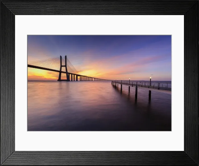 Framed Print : The colors of dawn on Vasco da Gama Bridge that spans the Tagus River, Lisbon, Portugal Framed Print : The colors of dawn on Vasco da Gama Bridge that spans the Tagus River, Lisbon, Portugal