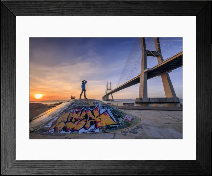 Framed Print : A tourist admires the majestic Vasco da Gama Bridge over the River Tagus, Parque das Nacoes Framed Print : A tourist admires the majestic Vasco da Gama Bridge over the River Tagus, Parque das Nacoes
