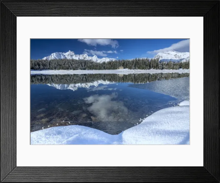 Framed Print : Wooden chalet surrounded by snowy peaks and woods reflected in Lake Palu, Malenco Valley Framed Print : Wooden chalet surrounded by snowy peaks and woods reflected in Lake Palu, Malenco Valley