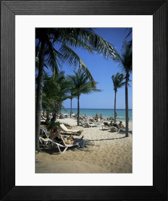 Framed Print : Tourists on the beach