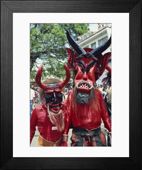 Framed Print : Portrait of two people with devil masks Framed Print : Portrait of two people with devil masks