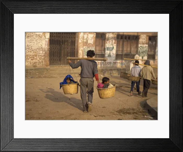 Framed Print : Kids taxi, two children carried in baskets on a pole Framed Print : Kids taxi, two children carried in baskets on a pole